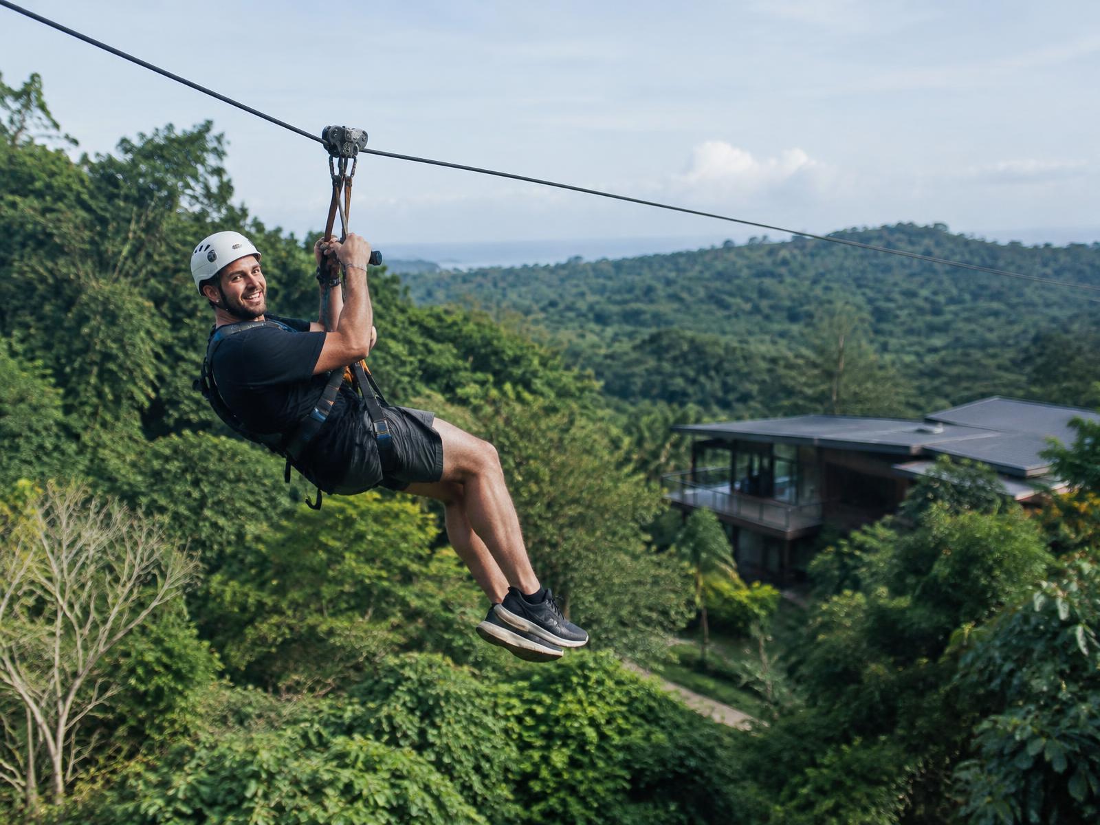 Guest riding the 400-metre zipline during a Pale Blue team day on the Gold Coast